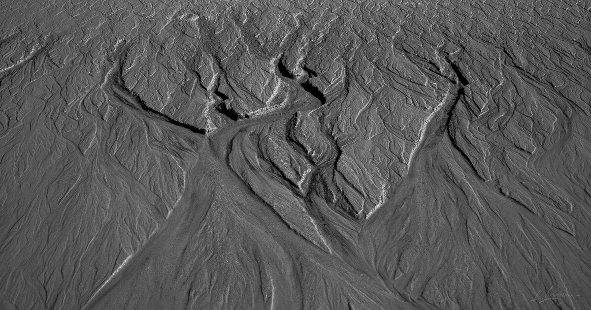Tidal sand patterns at low tide, Trancoso — photograph by Lawrence Leyderman