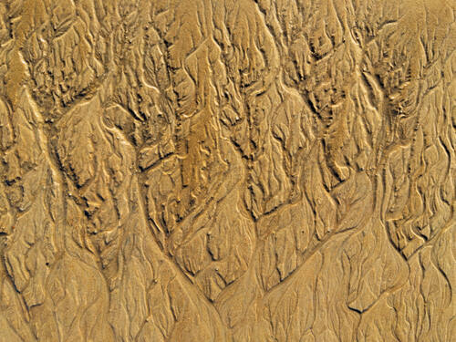 Tidal sand patterns at low tide, Trancoso — photograph by Lawrence Leyderman