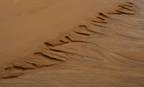Tidal sand patterns at low tide, Trancoso — photograph by Lawrence Leyderman