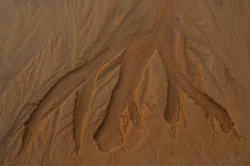 Tidal sand patterns at low tide, Trancoso — photograph by Lawrence Leyderman