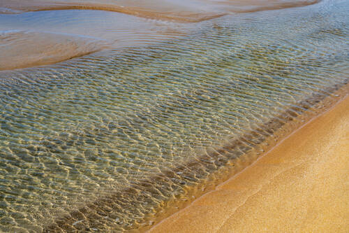 Tidal sand patterns at low tide, Trancoso — photograph by Lawrence Leyderman