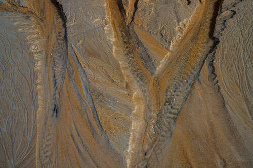 Tidal sand patterns at low tide, Trancoso — photograph by Lawrence Leyderman