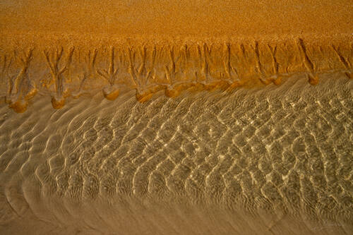 Tidal sand patterns at low tide, Trancoso — photograph by Lawrence Leyderman