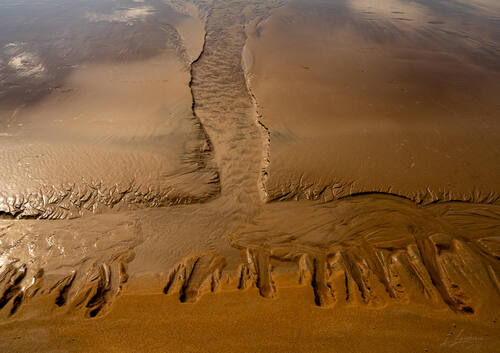 Tidal sand patterns at low tide, Trancoso — photograph by Lawrence Leyderman
