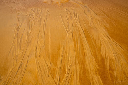 Tidal sand patterns at low tide, Trancoso — photograph by Lawrence Leyderman