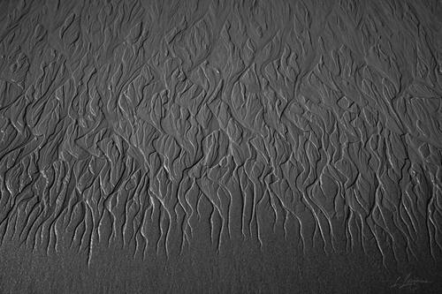 Tidal sand patterns at low tide, Trancoso — photograph by Lawrence Leyderman