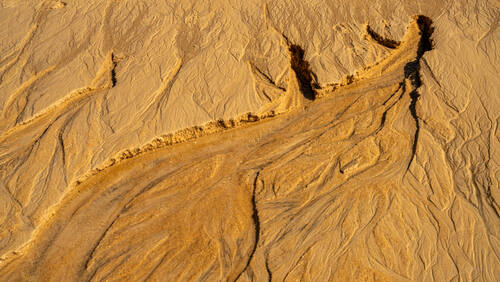 Tidal sand patterns at low tide, Trancoso — photograph by Lawrence Leyderman
