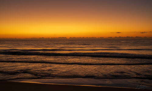Sunrise over the Atlantic at Trancoso — photograph by Lawrence Leyderman
