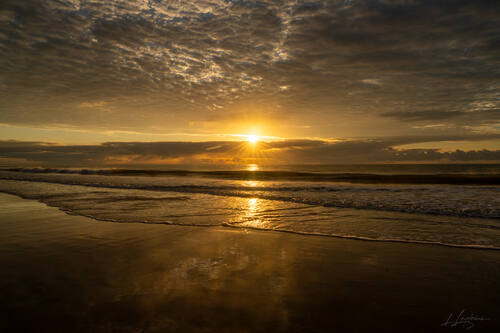 Sunrise over the Atlantic at Trancoso — photograph by Lawrence Leyderman