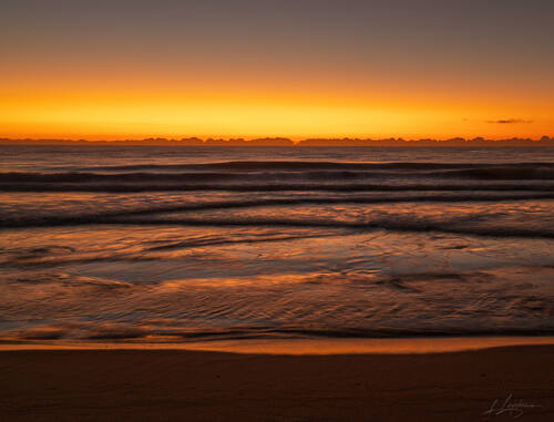 Sunrise over the Atlantic at Trancoso — photograph by Lawrence Leyderman